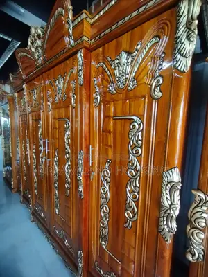 Get a royal Padma design 4-door Chittagong teak wood wardrobe
