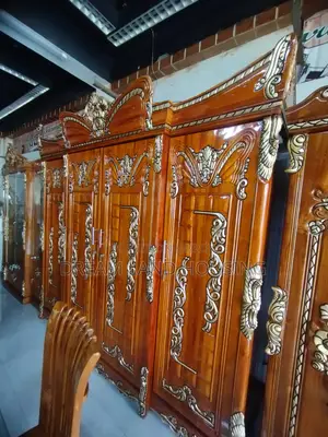 Get a royal Padma design 4-door Chittagong teak wood wardrobe
