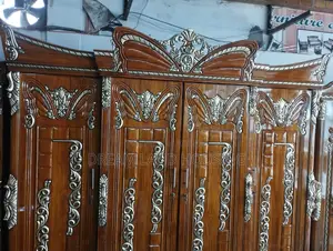 Get a royal Padma design 4-door Chittagong teak wood wardrobe
