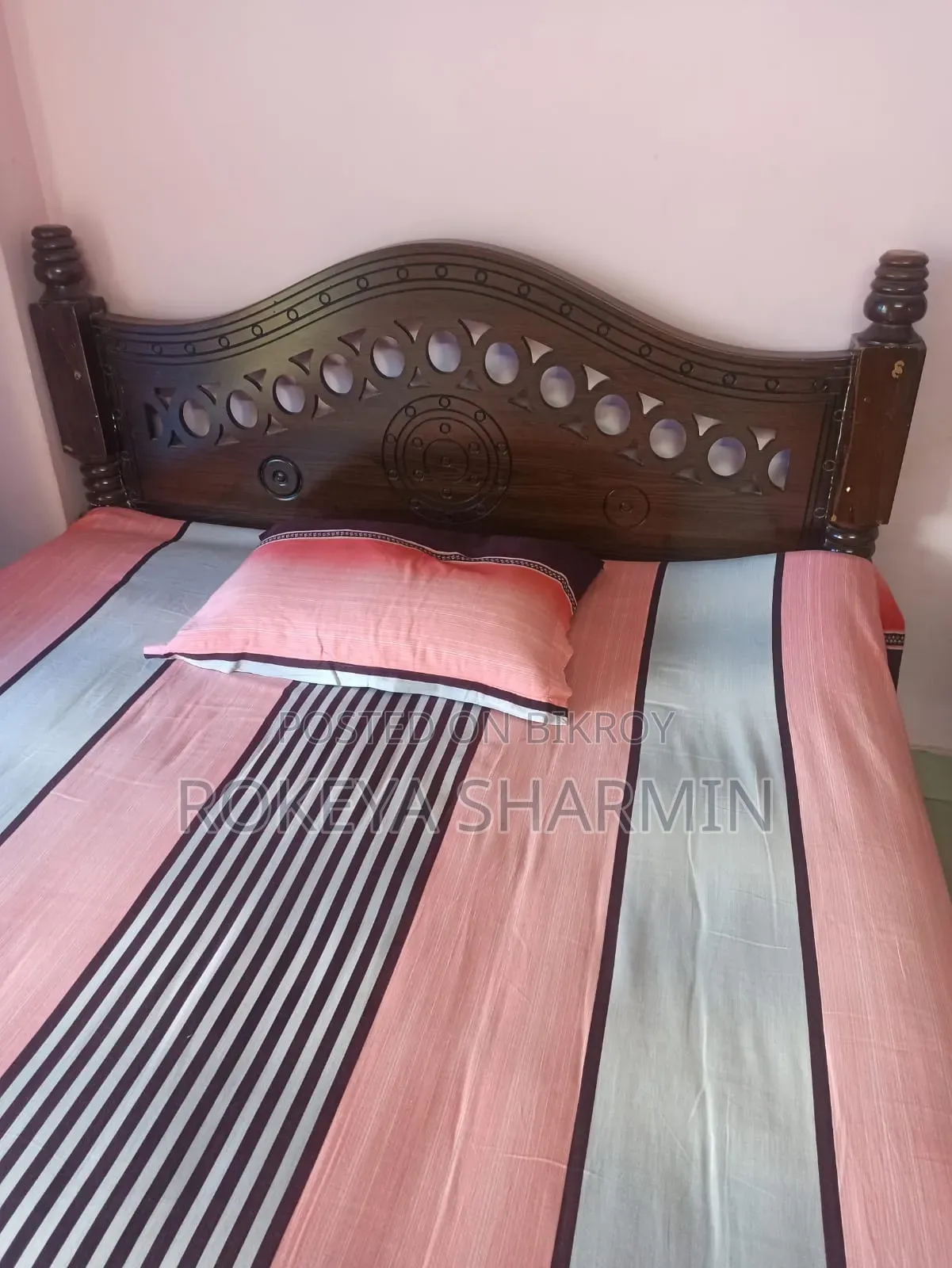 5-inch by 7-inch used wooden bed