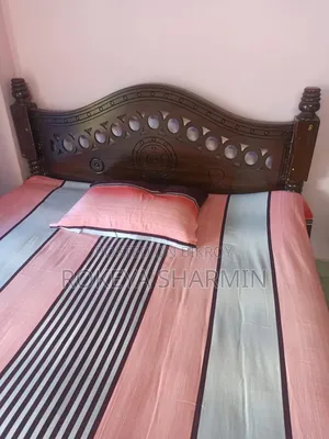 5-inch by 7-inch used wooden bed