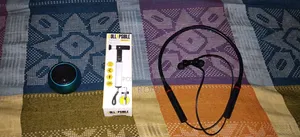An earphone with a selfie stand and a box