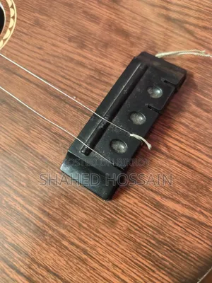 Guitar used for one week, two strings missing, includes two extra strings for 50