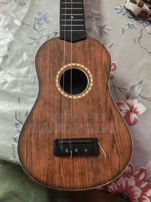 Guitar used for one week, two strings missing, includes two extra strings for 50