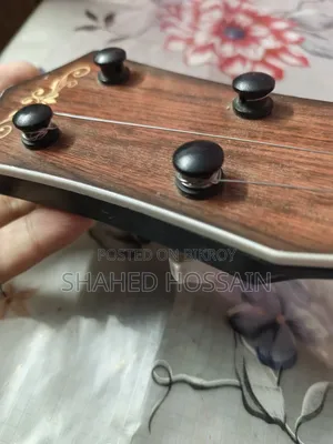Guitar used for one week, two strings missing, includes two extra strings for 50