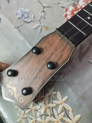 Guitar used for one week, two strings missing, includes two extra strings for 50