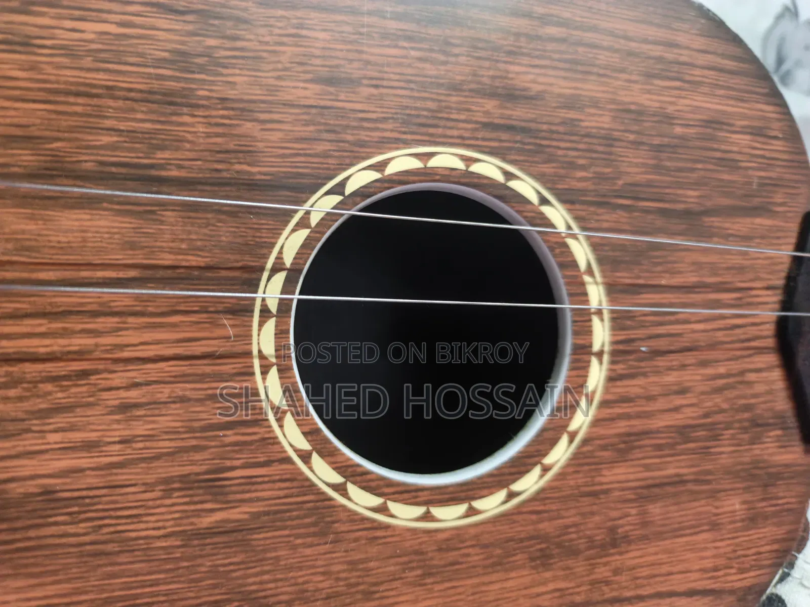 Guitar used for one week, two strings missing, includes two extra strings for 50