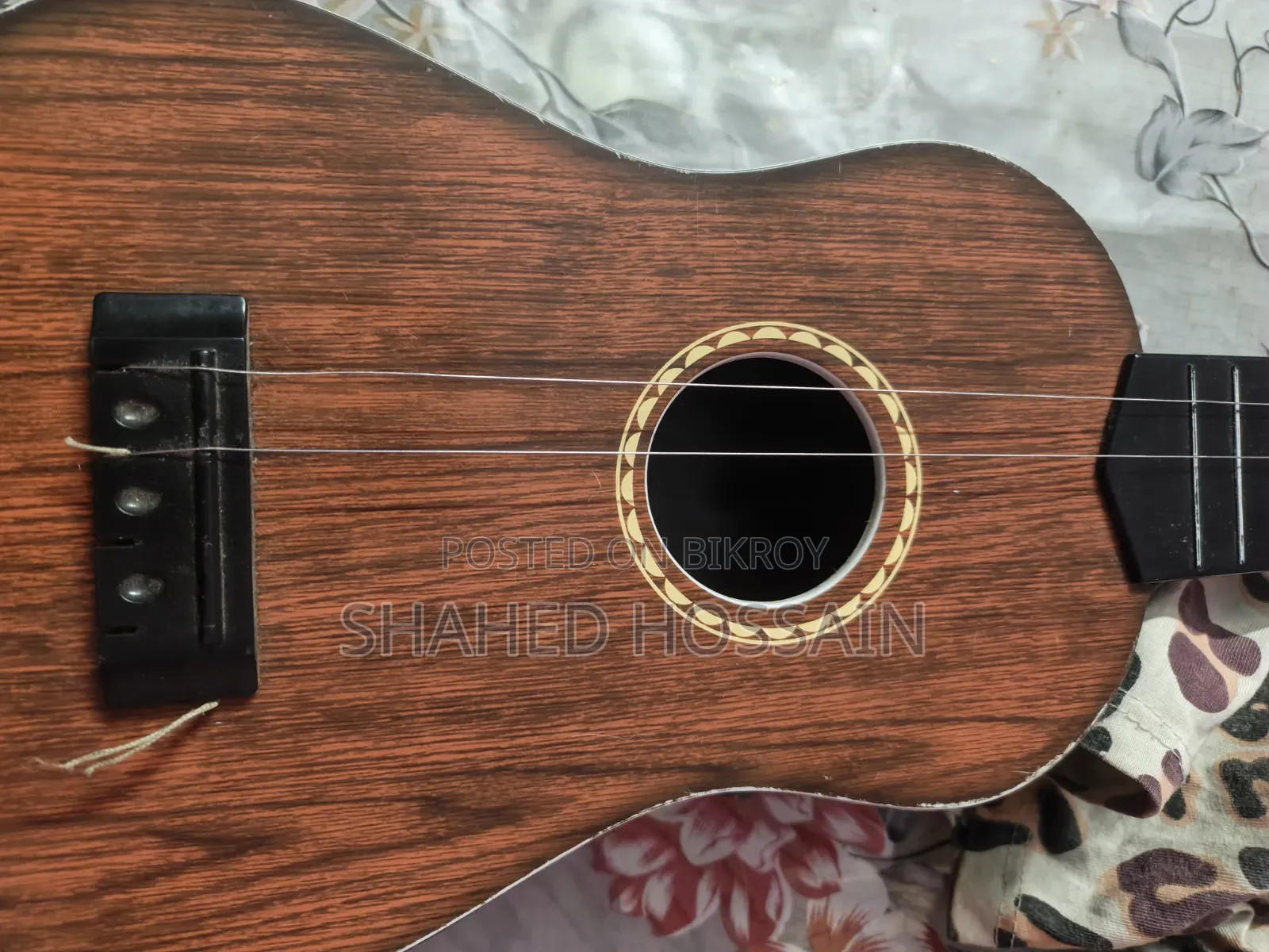 Guitar used for one week, two strings missing, includes two extra strings for 50