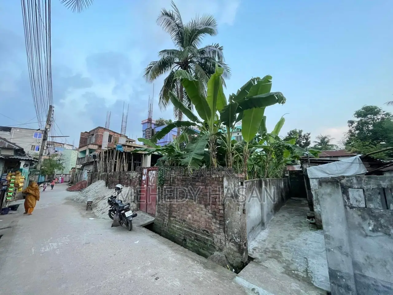 Corner plot for sale in Bogura Shibbati with approved 5-story plan.