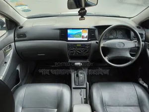 টয়োটা করোলা ২০০৪ সাদা