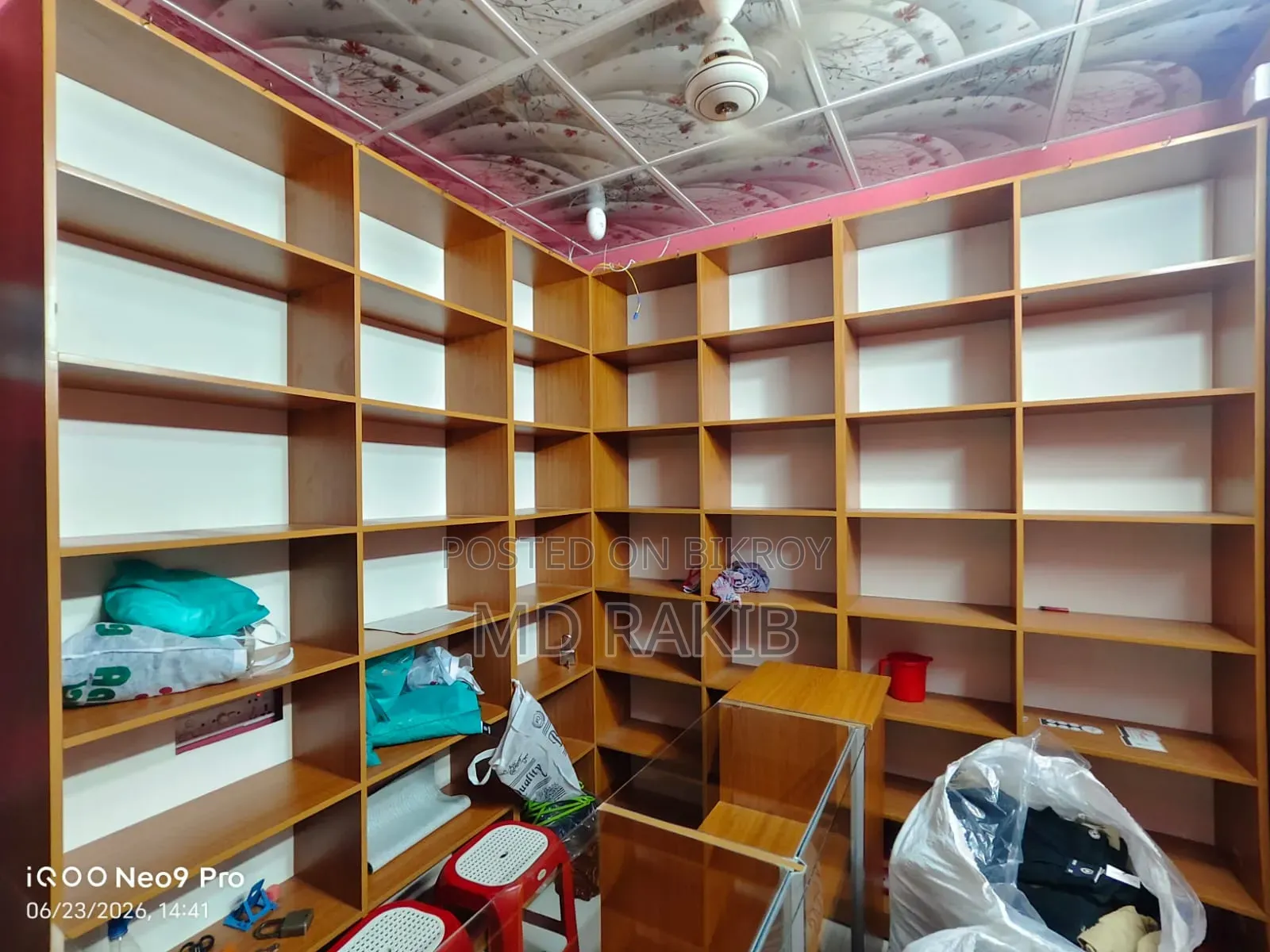 Garment shop shelves (with glass), cash counter and stool