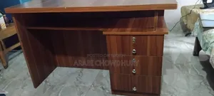 A study table for sale, can hold TV and computer