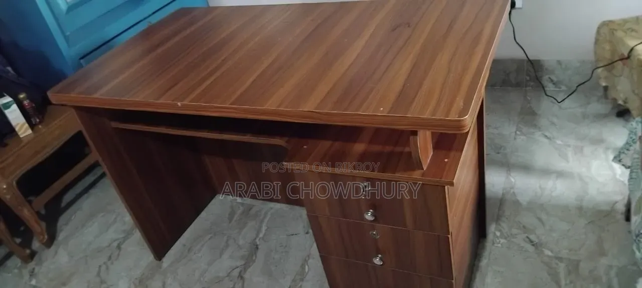 A study table for sale, can hold TV and computer