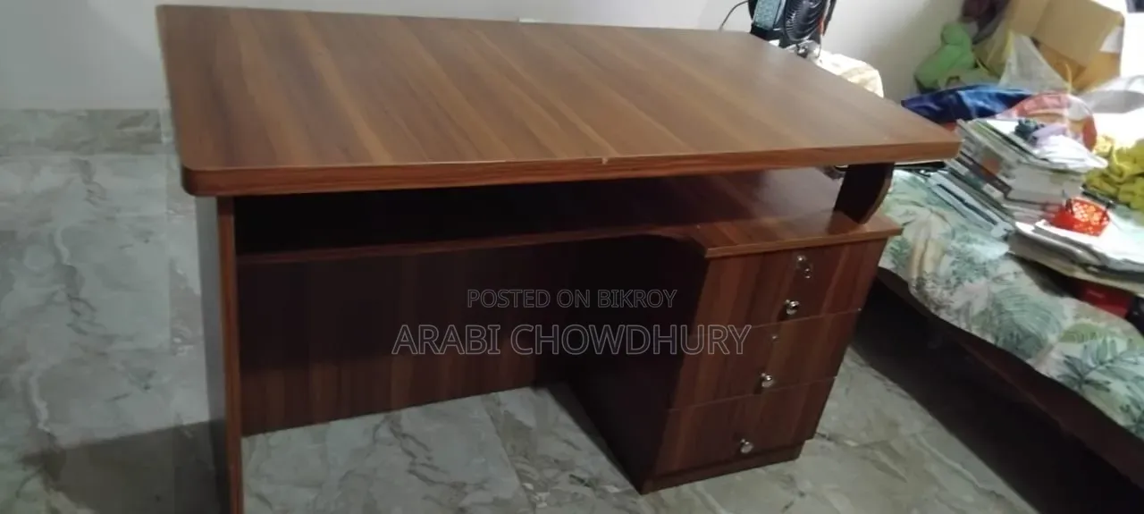 A study table for sale, can hold TV and computer