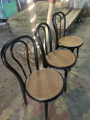Office table, 3 cane chairs, and revolving chair for sale
