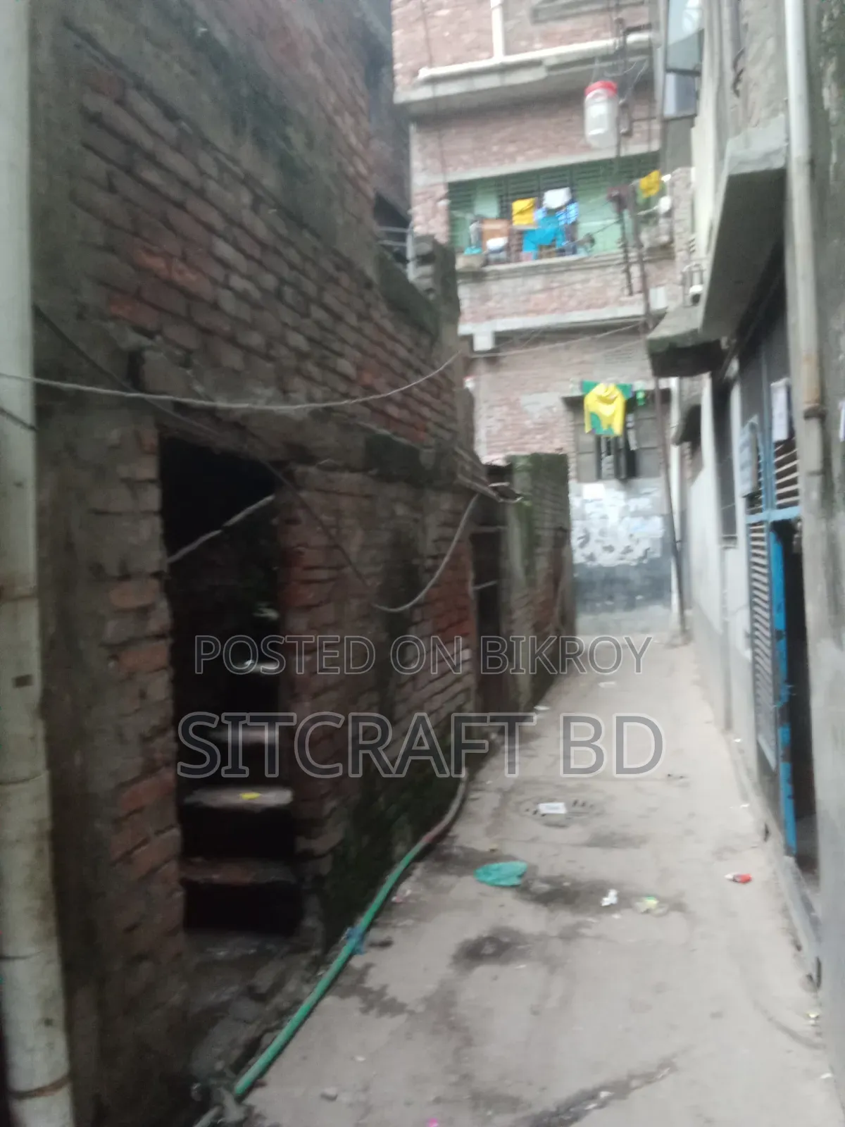 Land with tin-shed house for sale