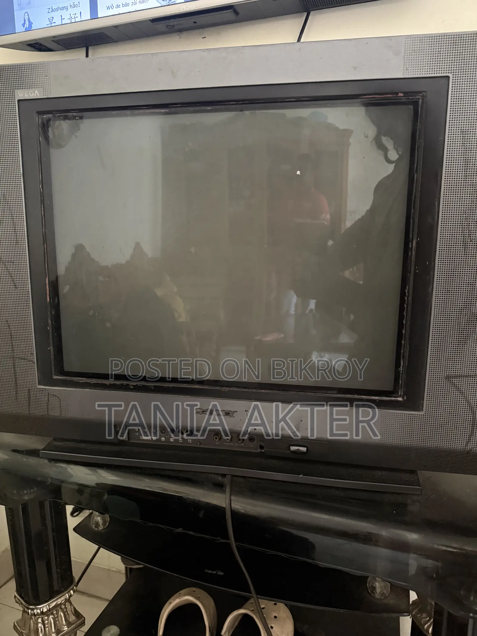 TV with trolley for sale.