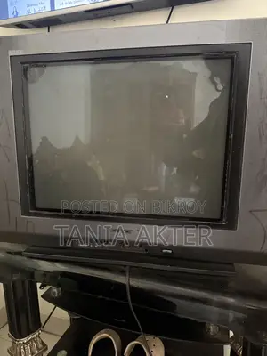 TV with trolley for sale.