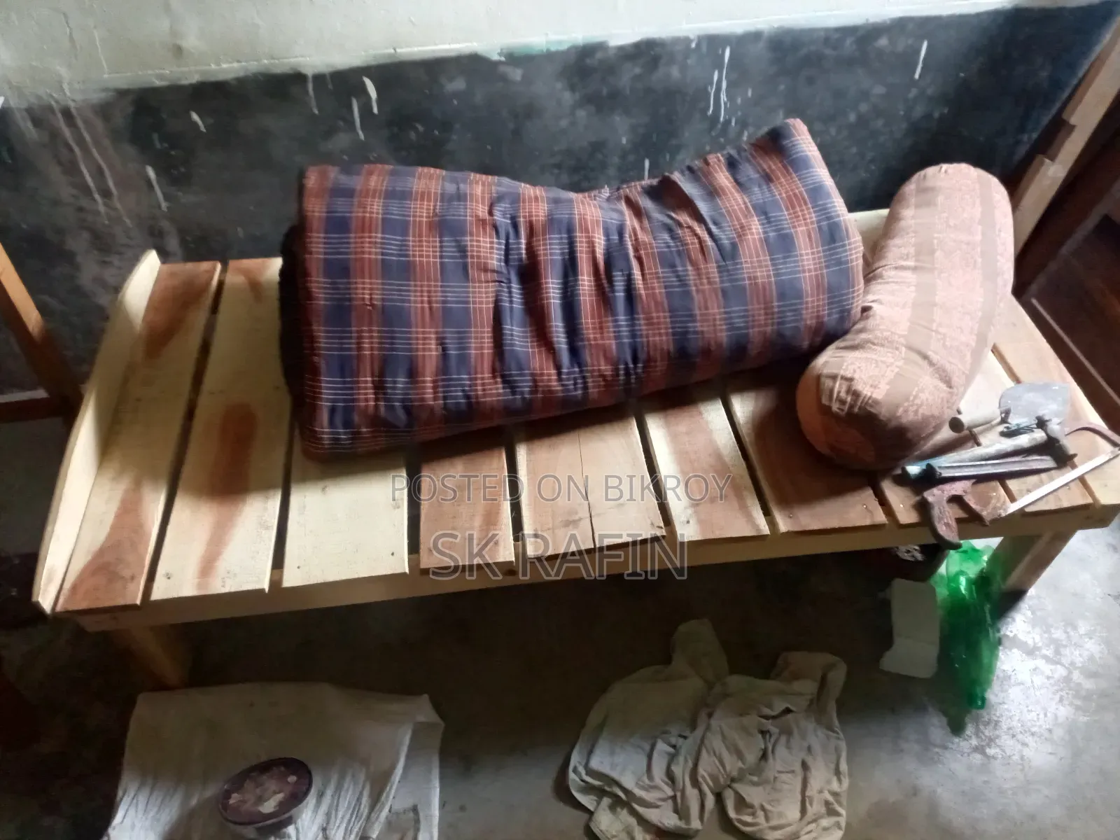 A wooden single bed/cot will be sold.