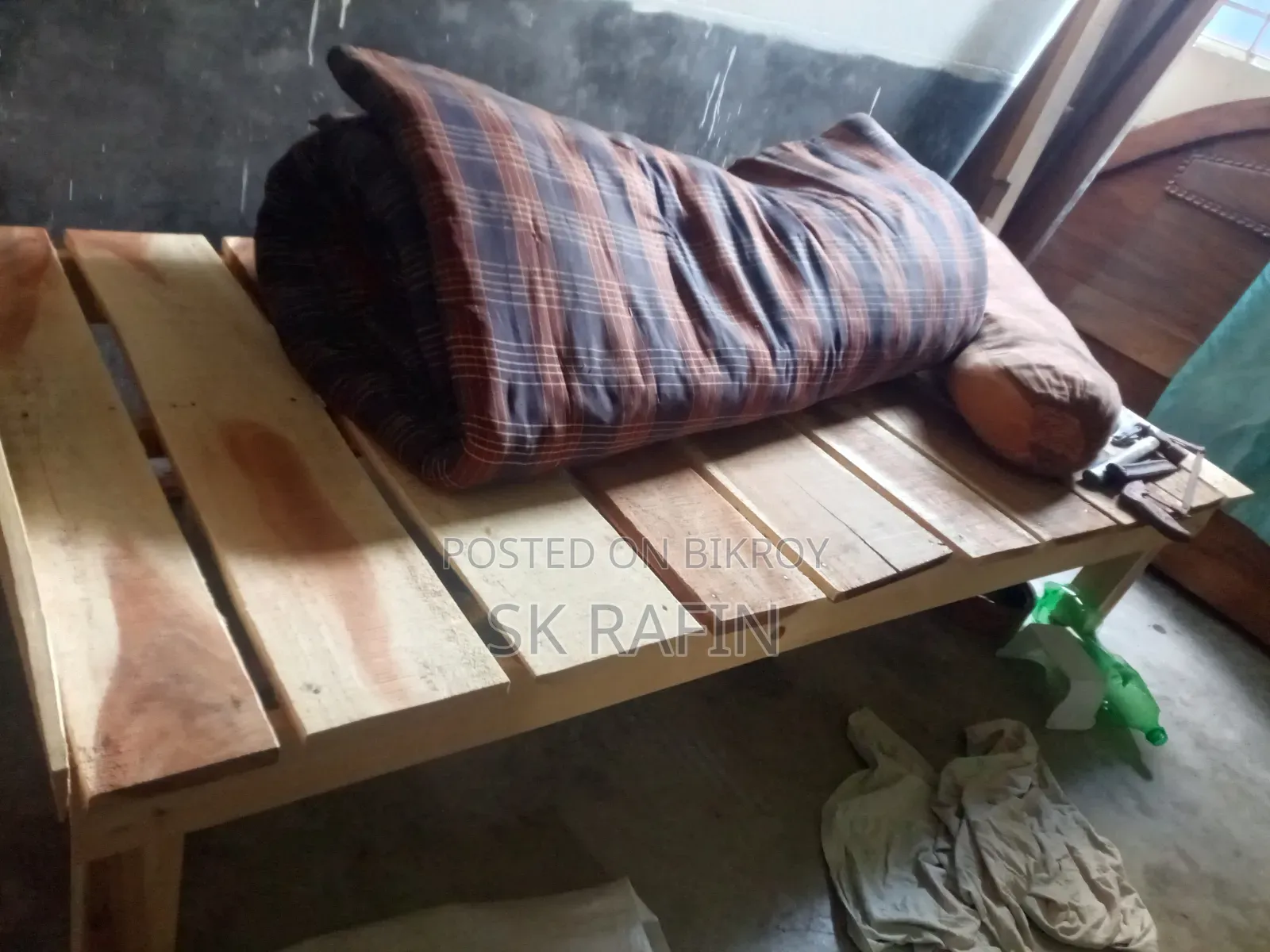 A wooden single bed/cot will be sold.