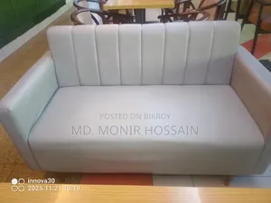 A pair of sofas and a table