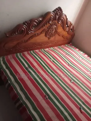 Teak wood bed for sale with mattress.