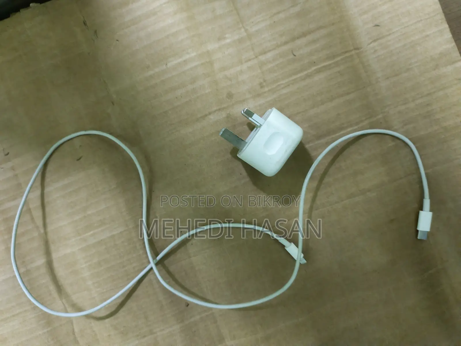 An iPhone charger for sale.