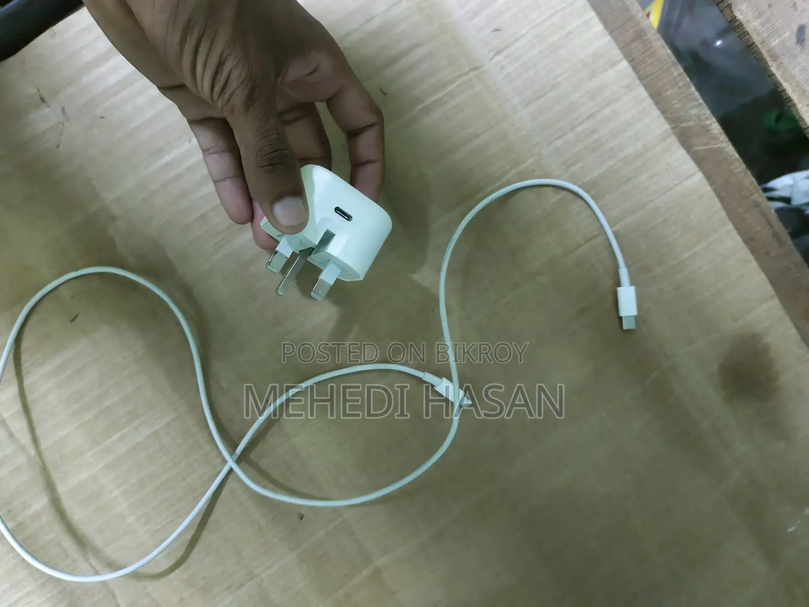 An iPhone charger for sale.