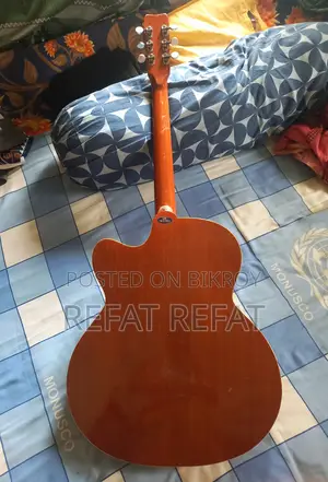 It's a Givson Acoustic Guitar. I'm Selling It in Dhaka. Contact WhatsApp