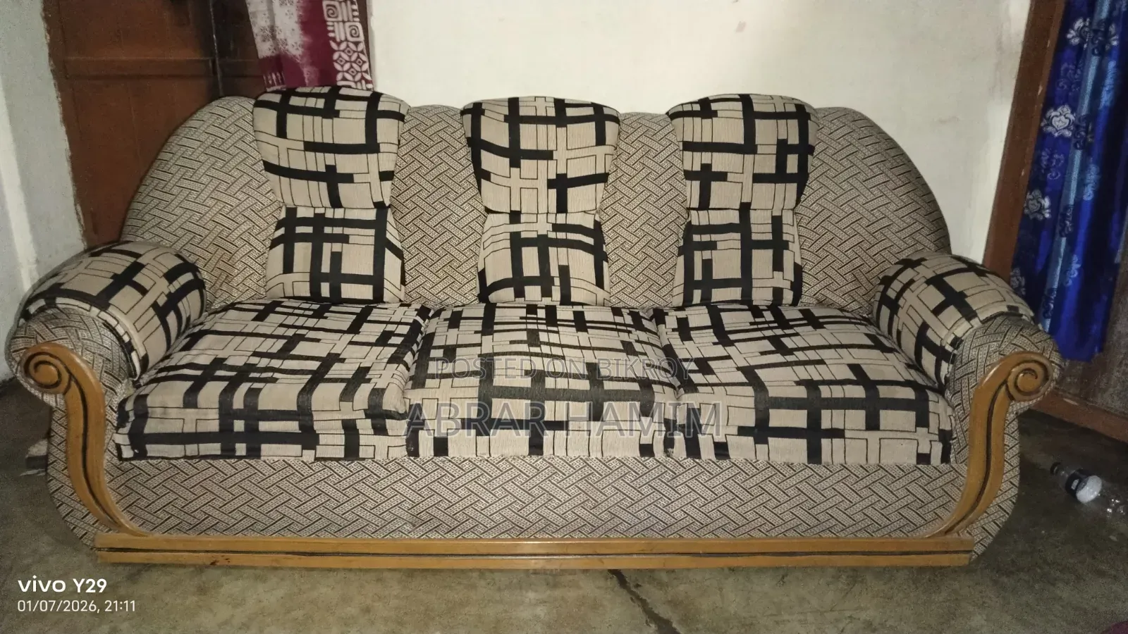 This is a Teak Wood Sofa