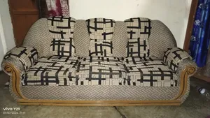 This is a Teak Wood Sofa