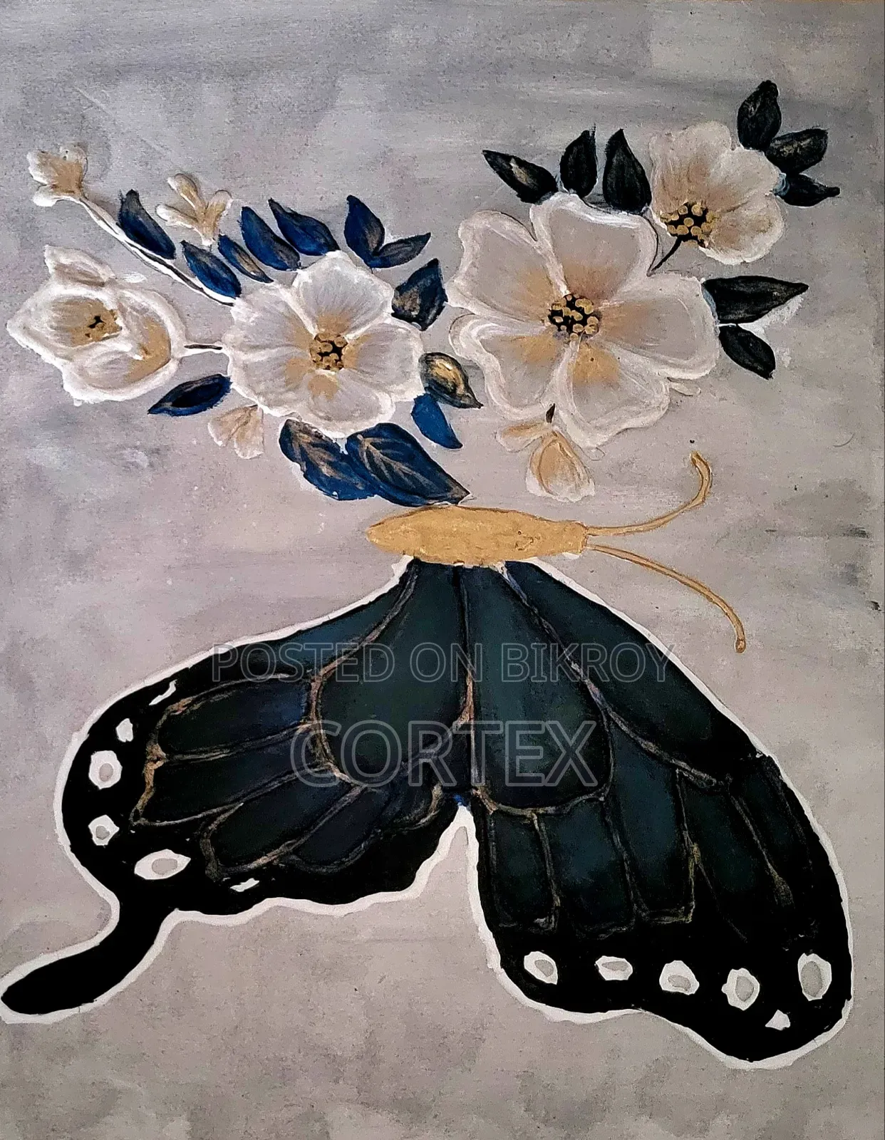 This is a handmade mixed-media artwork of a butterfly and flowers.