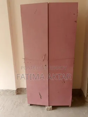 Pink colored shelf in good condition