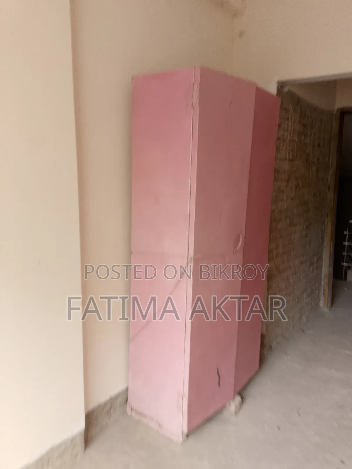 Pink colored shelf in good condition