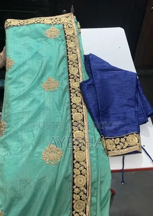 Sea Green Silk Saree With Navy Blue Embroidered Border