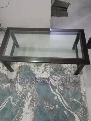 3 Sofas and a Glass Table