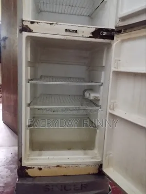 Selling a Singer Refrigerator, currently running, only the door has a slight gap