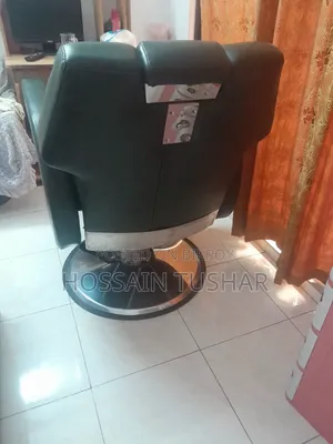 A total of 2 identical second-hand salon chairs for sale