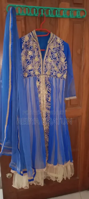 Beautiful, flawless, heavily embroidered dress. Looks as good as new