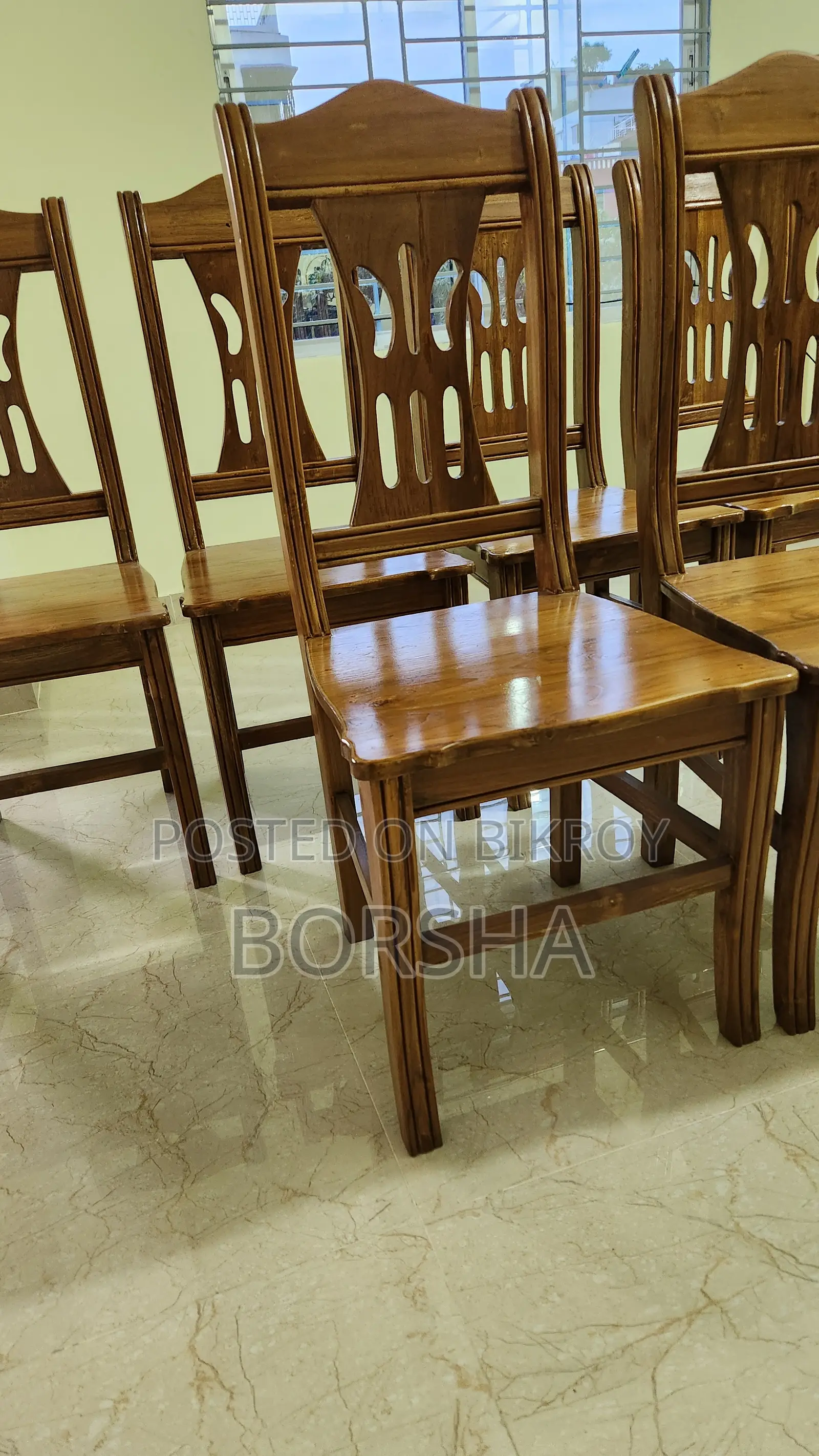 Six chairs made of teak wood