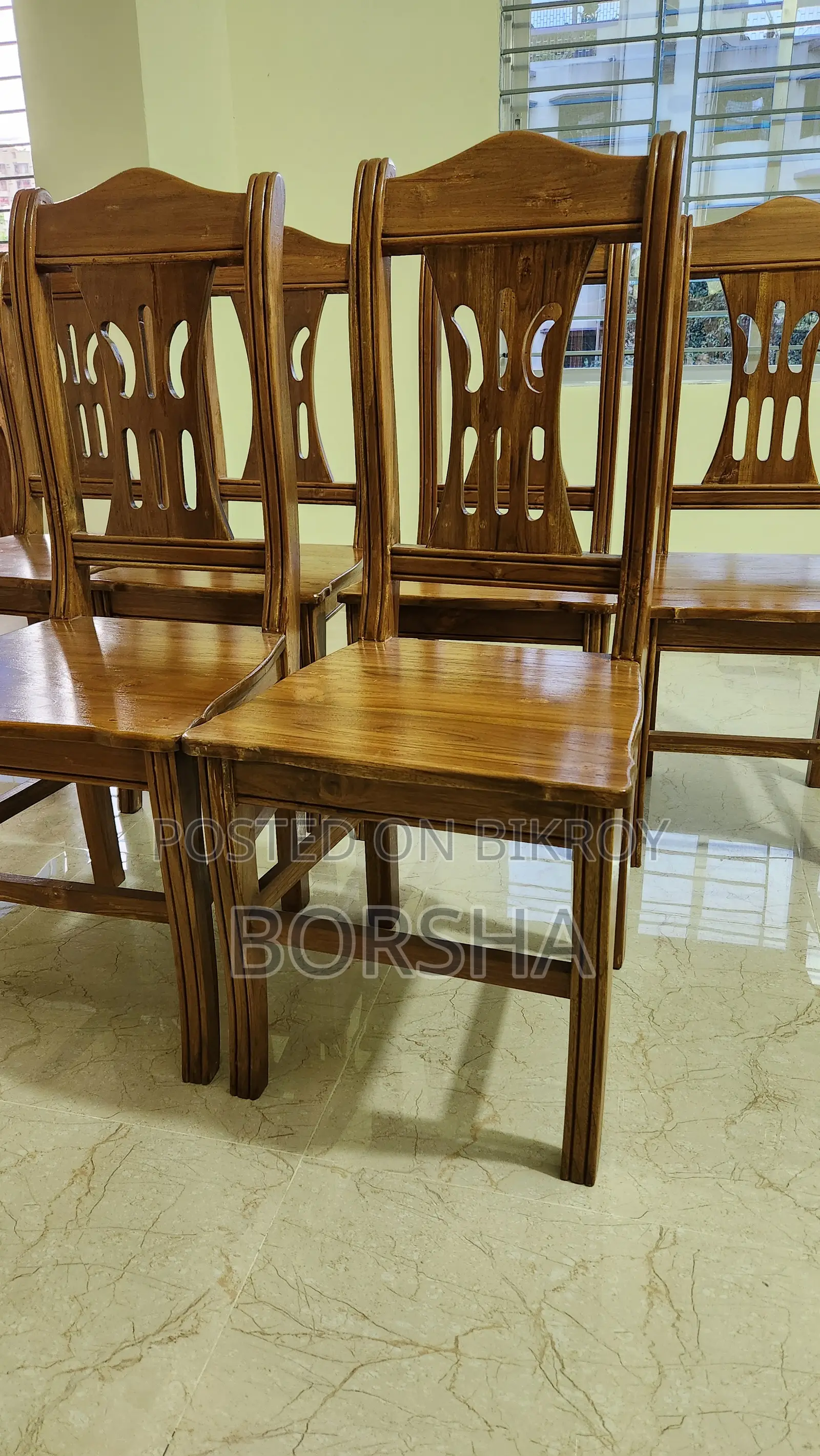 Six chairs made of teak wood