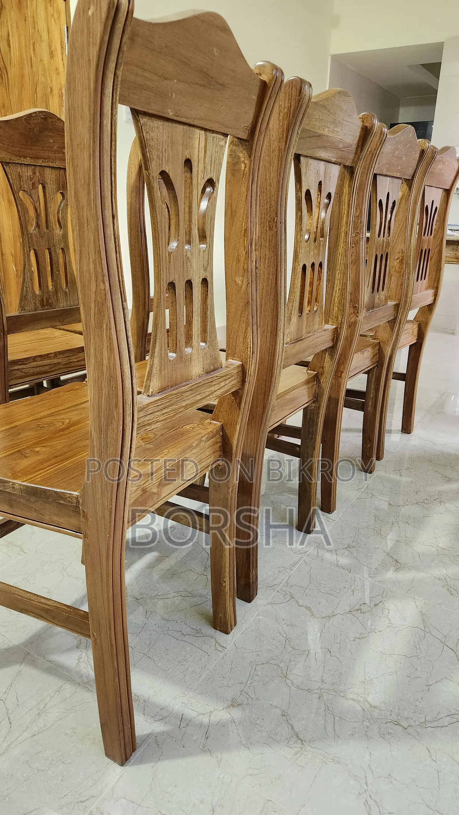 Six chairs made of teak wood