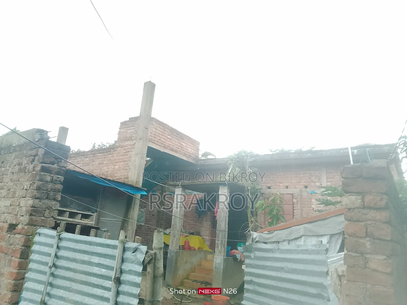 Land with house for urgent sale