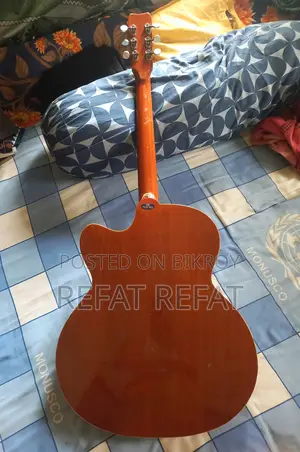 It's a Givson Acoustic Guitar. I'm Selling It in Dhaka. Contact WhatsApp