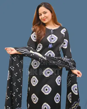 Soft cotton fabric Chunri print three-piece collection with tassels.
