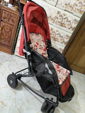 Used Baby Stroller (Red/Patterned) – Excellent Condition