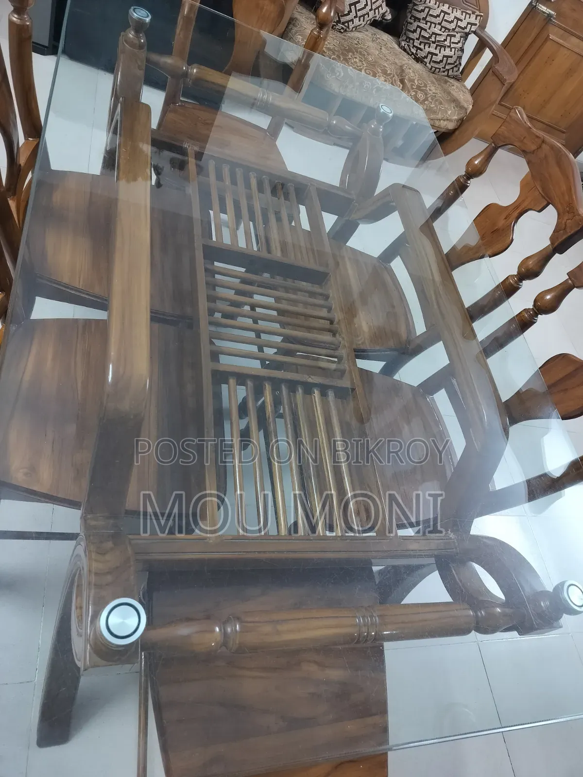 Teak wood 6-chair dining table.