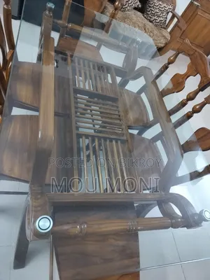 Teak wood 6-chair dining table.