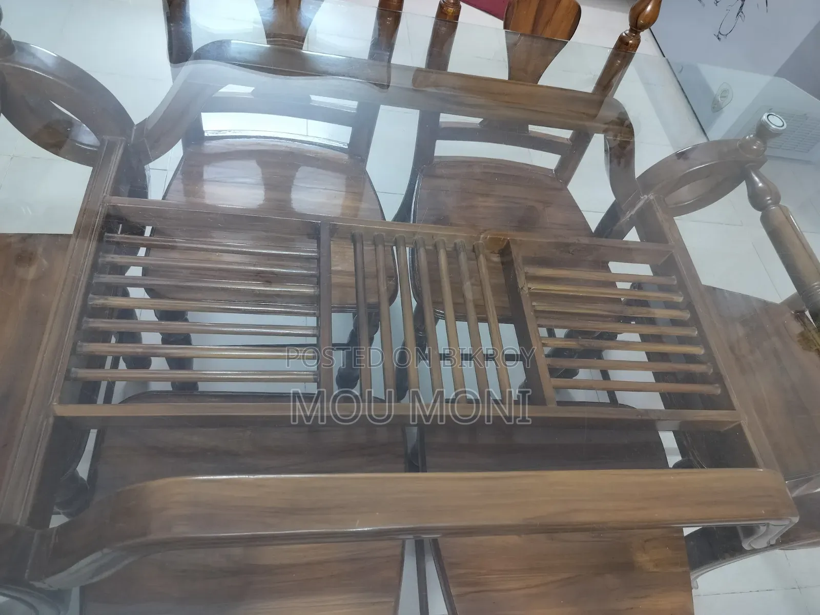 Teak wood 6-chair dining table.