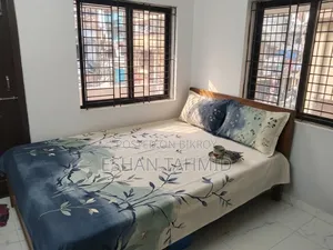 Teak wood bed.